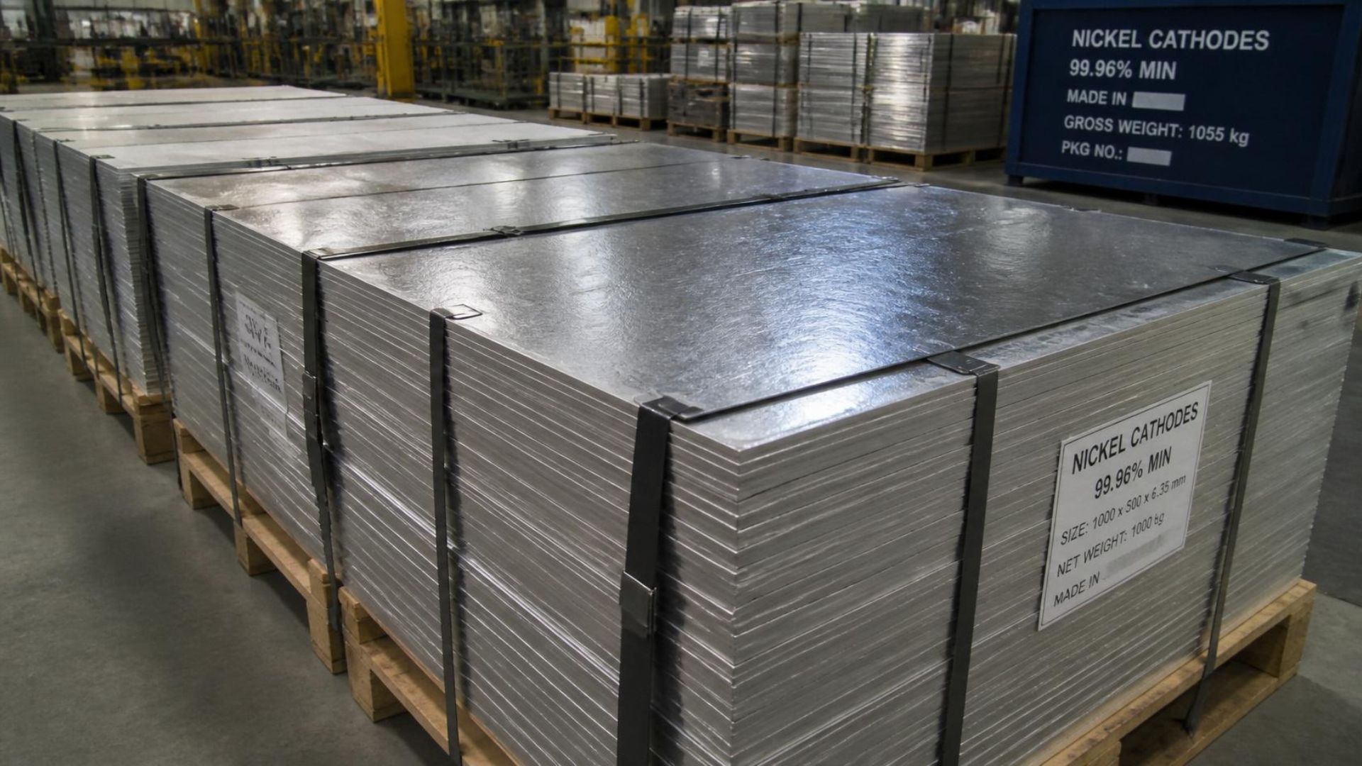 A pile of nickel cathodes on a pallet in a warehouse